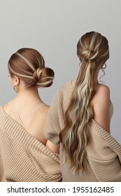 Two Ladies Are Showing Difference In Hairstyle With And Without Brown Pony Tail Highlighted With Blonde Strands. Girls In The Same Beige Cardigan And Top Are Faced Away. 