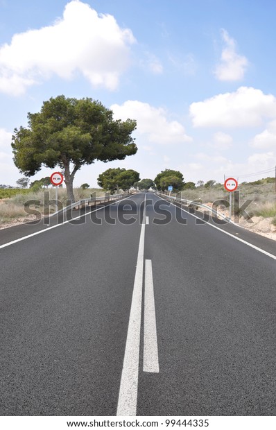 Two Lane Highway\
Roadway Street (N340 between Alicante and Torrellano) with Speed\
Limit Signs in Spain Europe