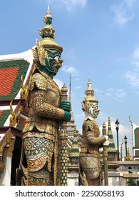 Two Large Daemon Statues in the Temple at Wat Phra Kaew in Bangkok, Thailand