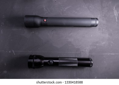 Two large flashlight. Police flashlights. Black lanterns. - Shutterstock ID 1330418588