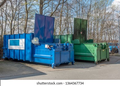 two large garbage compactors standing on a hospital site - Powered by Shutterstock