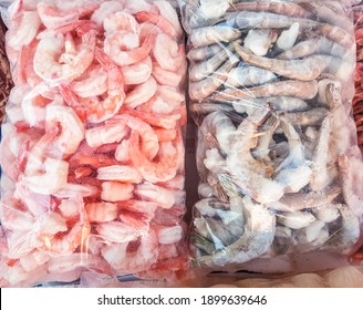 Two Large Plastic Bags Of Frozen Raw And Cooked Shrimp, On The Counter Of The Fish Market.