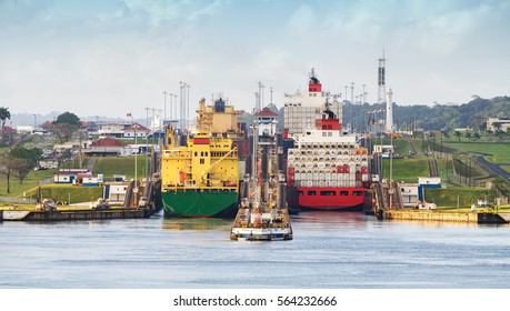 two large ship enters the Panama Canal on the Atlantic side