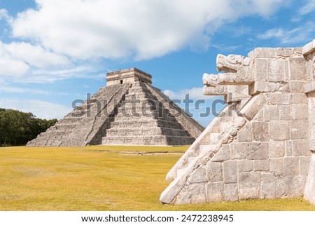 Two large snake heads carved from stone at the ancient Mayan ruins at Chichen Itza - The pyramid of Kukulcan in the Mexican city of Chichen Itza - Yucatan, Mexico