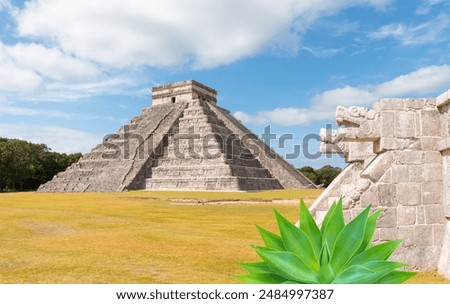 Two large snake heads carved from stone at the ancient Mayan ruins at Chichen Itza - The pyramid of Kukulcan in the Mexican city of Chichen Itza - Yucatan, Mexico