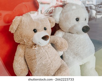 Two large teddy bears behind store window, perfect childhood symbol and toy shop display
