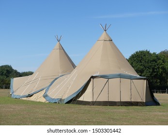 Two large tepees set up for event on farmland