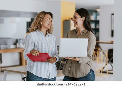 Two Latin Business Woman Middle Age Working With Computer At The Office In Mexico Latin America	