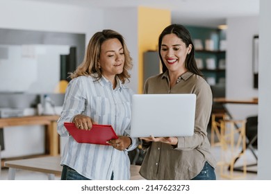 Two Latin Business Woman Middle Age Working With Computer At The Office In Mexico Latin America	