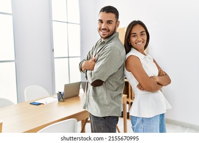 Two latin business workers smiling happy standing with arms crossed gesture at the office. - Shutterstock ID 2155670995