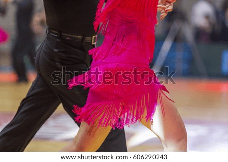 two latino dancer on the floor