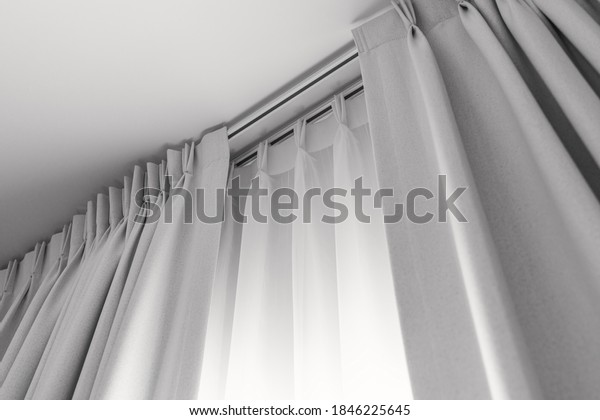 Two layers curtain with rails,\
installed on ceiling, translucent and blocking lights\
curtain