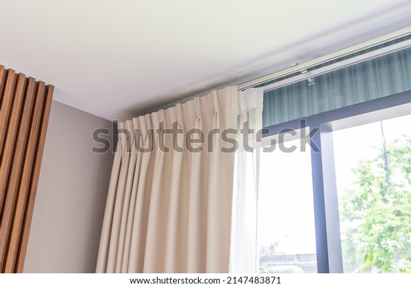 Two layers curtain with rails,\
installed on ceiling, translucent and blocking lights\
curtains