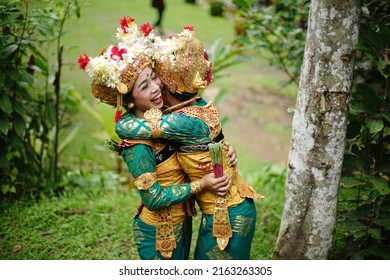 Two Legong Dancing Girls In Happiness, 09 December 2018, Badung - Bali - Indonesia