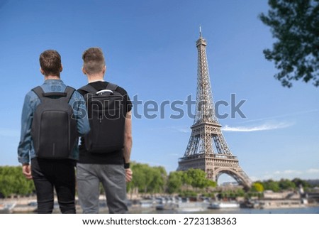 Two LGBT+ men in front of the Eiffel Tower. Paris, France.