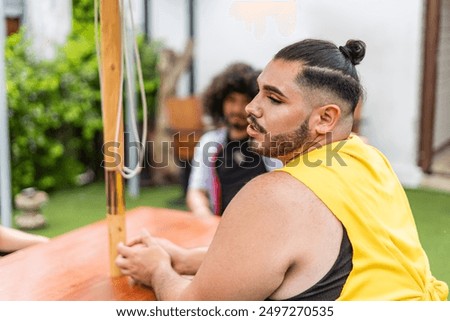 Two LGBTQ friends sitting at the table. High quality photo