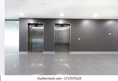 Two Lifts Or Elevators In A Building Lobby.