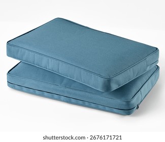 Two light blue rectangular cushions resting on white background