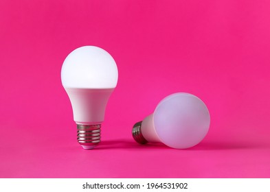 Two Light Bulbs, One Of Them In Upright Position And Glowing. Concept Of Occupational Burnout.