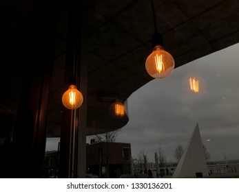 Two lights beeming up the grey and depressing tone by the window wintertime in Sweden
