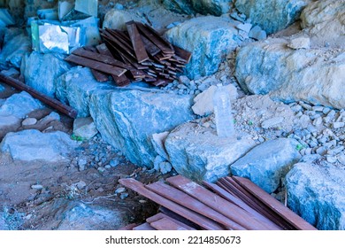 Two Litre Plastic Bottle Of Water Sitting On Boulder.