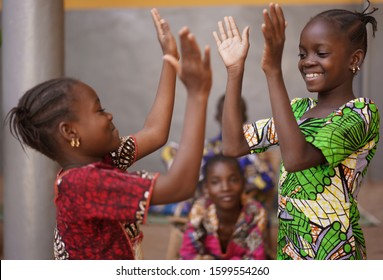 Two Little African Girls Performing A Hand Clapping Game