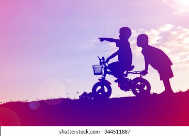 Two Little Boys Bike Silhouette