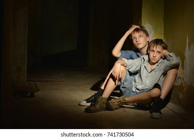 Two Little Boys In Dark Cellar