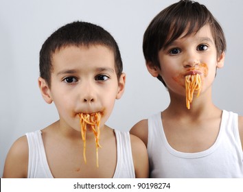 Two Little Boys Eating Spaghetti