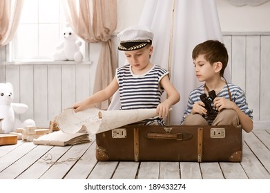 Two little boys in the image of sailors playing in her room 