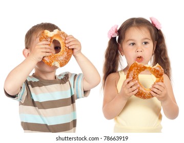 Two Little Children Eating Bagels