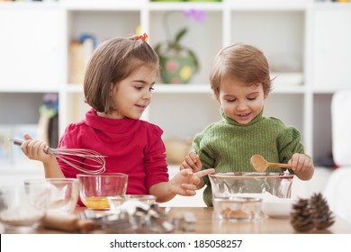 Two Little Children Making Cookies.