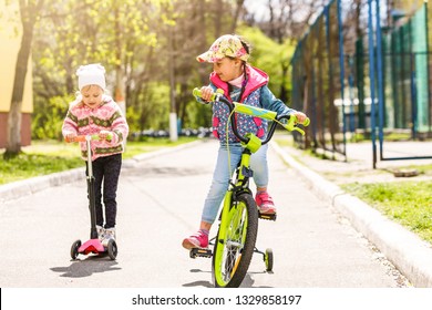 Two Little Children Riding Their Bikes Stock Photo 1329858197 ...