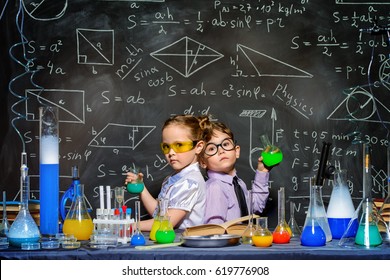 Two little children scientists making experiments in the laboratory. Educational concept. Early development of children. - Powered by Shutterstock