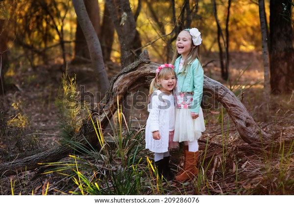 Two Little Fashion Girl Autumn Park Stock Photo