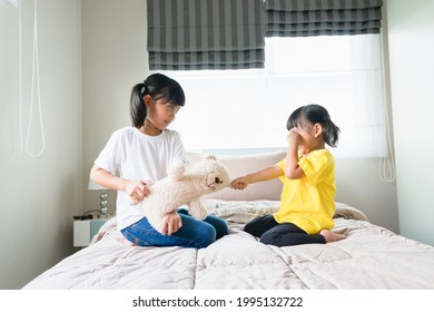 Two Little Girl Fighting Over Bear