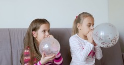 Two Little Girls Blowing Balloon Prepare Festive Birthday