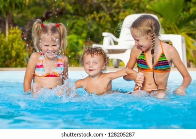 Two naked girls playing with one boy