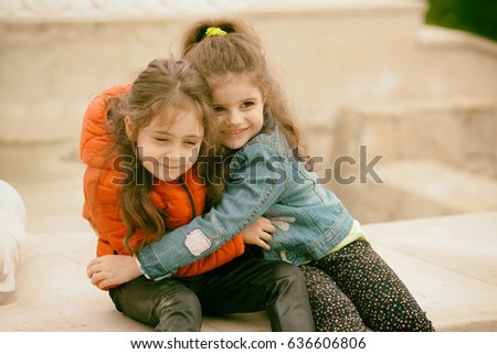 Mother with her seven year old daughter laughing in a cabin in the countryside