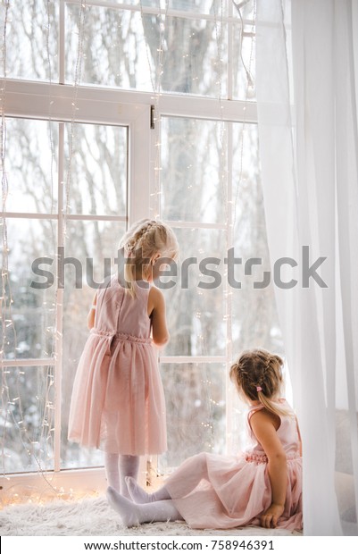 Two Little Girls Look Out Window Stock Photo Edit Now 758946391 The study, carried out at mcmaster universityin ontario, canada, asked men and women volunteers to look at lingerie models and rate them in terms of attractiveness while others were shown abstract art. https www shutterstock com image photo two little girls look out window 758946391