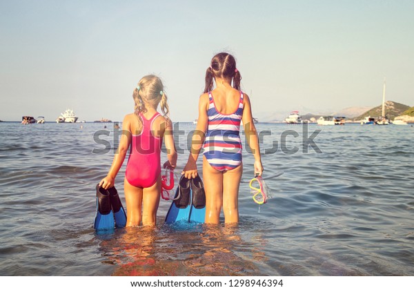 Two Little Girls On Beach Seaside Stock Photo (Edit Now) 1298946394