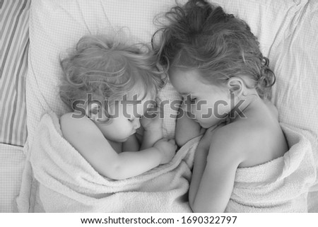 Similar – Little girl holding cookie sitting over the bed