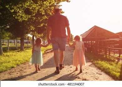 Two Little Girls Spending Time On The Farm. Granddaughters Walking With Hers Grandpa. 