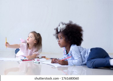 Two Little Girls-friends With Different Complexion Looking Someone, Bias Racial Concept, Selective Focus