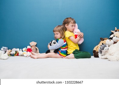 Two Little Kids, Brother And Sister Fighting Over A Toy. The Conflict Between Children.
