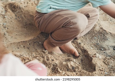 Two Little Kids Enjoying Nature Playing In Sand. Baby Development. Smiling Happy Child. Home Garden. Summer Vacation Fun. Happy Face.