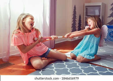 Two Little Mad Angry Girls Sisters Having Fight At Home. Friends Girls Can Not Share Toy. Lifestyle Authentic Funny Family Moment Of Siblings Quarrel Life. Kids Bad Behaviour. 