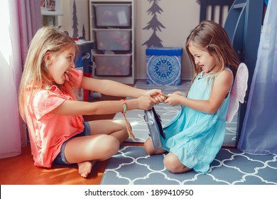 Two Little Mad Angry Girls Sisters Having Fight At Home. Friends Girls Can Not Share Toy. Lifestyle Authentic Funny Family Moment Of Siblings Quarrel Life. Kids Bad Behaviour. 