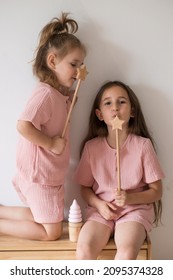 Two Little Sister Girls In Matching Pink Pajamas