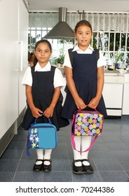 Two Little Sisters Going To School.